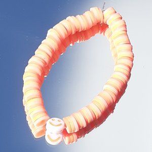 Clay bead stretchy string bracelet When you buy 2 you get 1 free bracelet!